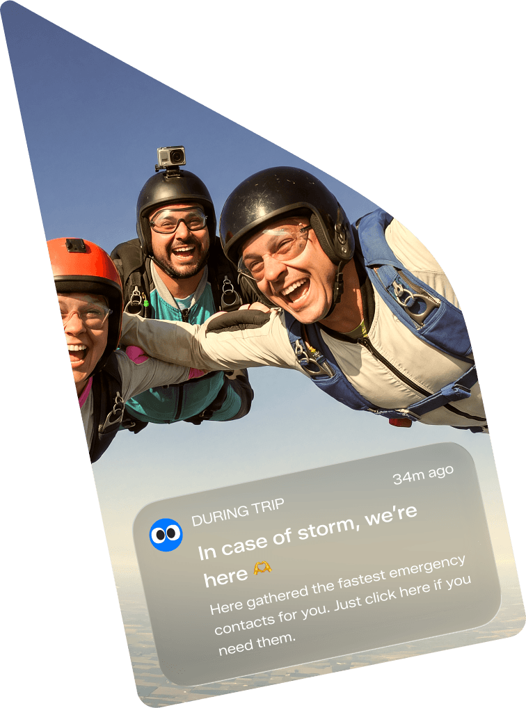 Three skydivers, shown as a small photograph
